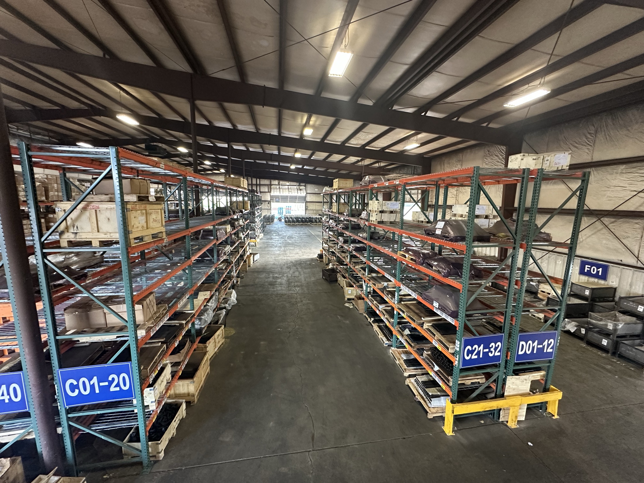 warehouse-racking Organized pallet racking with location-coded bins